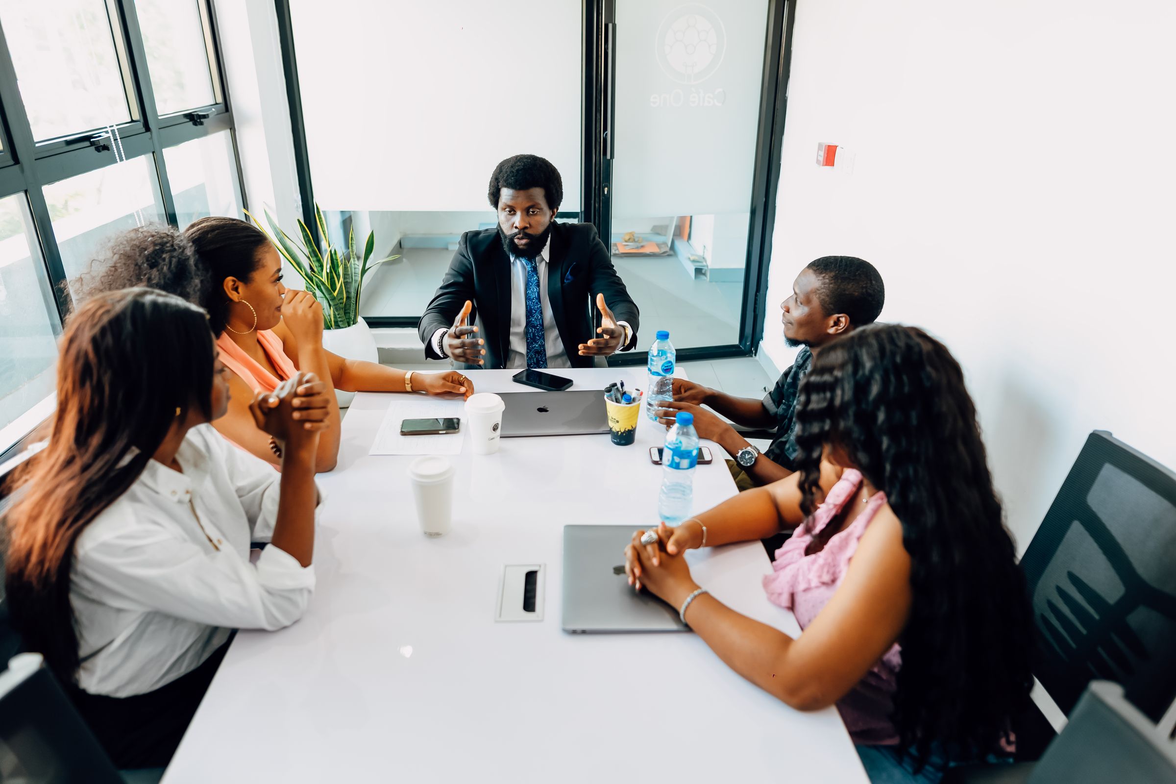 Black African professional team collaborating in a modern office